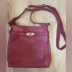 Arthur et Aston red leather purse with crossbody strap.